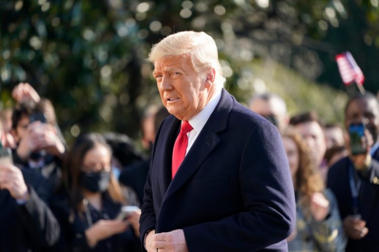 President Donald Trump walks to board Marine One on the South Lawn of the White House, Tuesday, Jan. 12, 2021 in Washington. The President is traveling to Texas. (AP Photo/Gerald Herbert)