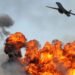 Heavy bomber dropping bombs on ground targets